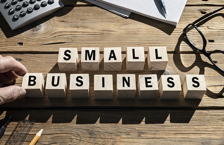 Small Business words on blocks SME and entrepreneur startup businesses concept